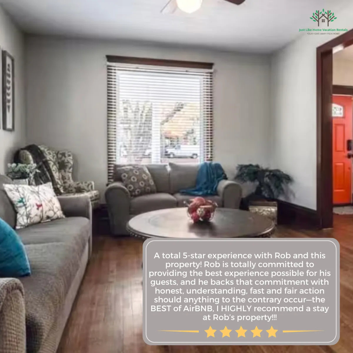 This image depicts a cozy living room with a comfortable sofa, a coffee table, and a window with blinds allowing in natural light. The space is styled for relaxation and socializing, encouraging guests to unwind or gather together.